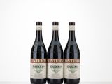 three bottles of wine sitting on top of a table next to each other