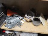 a pile of assorted items on a shelf in a room