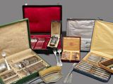 a lot of silverware in a case on a table