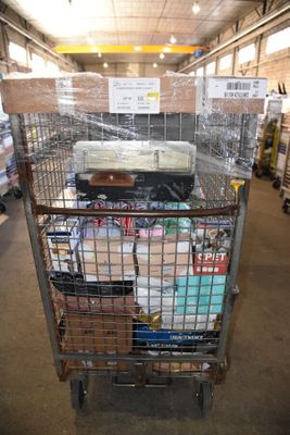 a shopping cart with many items in it in a warehouse