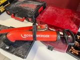 a red tool that is sitting on a table