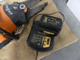 a chainsaw and two batteries on a table