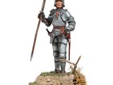 a figurine of a man in armor holding a sword