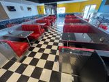 a black and white checkered floor in a diner