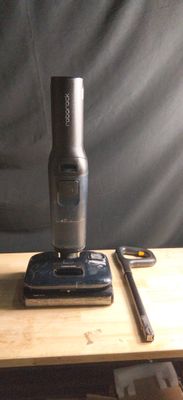 a cell phone sitting on top of a table next to a cell phone
