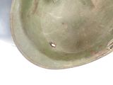 a close up of a helmet on a white surface