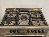 an image of a stainless steel stove top oven with four burners