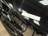 a close up of a car with a sticker on it ' s hood