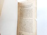 an open book with writing on it sitting on a table