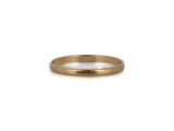 a close up of a gold wedding ring on a white background