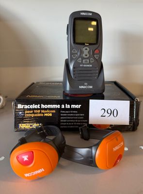 a remote and headphones sitting on a table next to a box