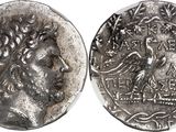 a silver coin with an image of a man on it