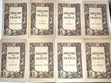 six books on a table with a black and white picture of them