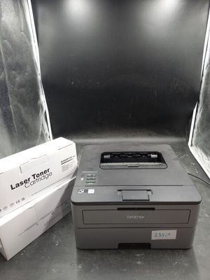 a printer sitting next to a box on a table