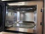 a microwave that is sitting on a counter top