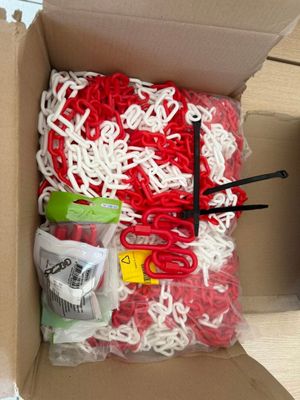 a cardboard box with a bunch of red and white items in it