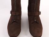 brown boots with zippers and buckles on a white background
