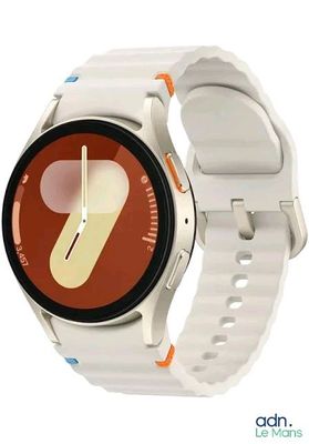 a smart watch with a white band and a red face