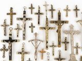 many different types of crucifs displayed on a wall