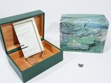 a box with a note inside of it and a ring in it