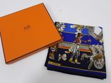 an orange box with a blue and orange scarf and a blue and orange scarf
