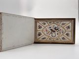 a small box with a picture on it sitting on a table