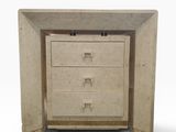 an image of a small chest of drawers with a door open