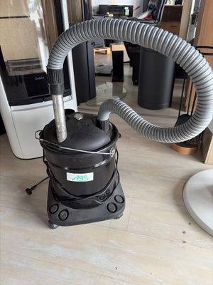 a vacuum that is sitting on the floor in a room