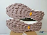 the soles of a pair of hiking shoes on a cardboard box