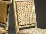 pair of chairs with floral upholstered upholstered back and upholstered upholstered back