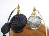a bottle of perfume sitting on top of a brown bag