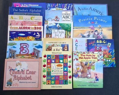 many children ' s books that are on the table