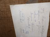 a piece of paper with writing on it sitting on a chair