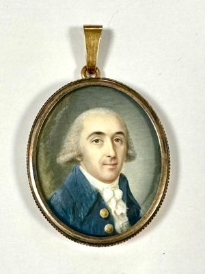 portrait of a man wearing a blue coat and white shirt