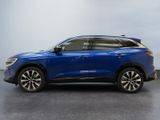 a blue 2020 toyota rav parked in front of a gray background