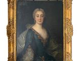 portrait of a lady in a blue dress by a gold frame