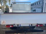 a white truck that is parked on the side of the road