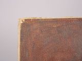 an old book sitting on top of a wooden table