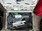 an open box with tools in it sitting on the ground