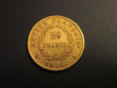 a gold coin with the number twenty on it