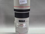 a camera lens sitting on top of a cup on a table