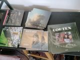 a lot of cd ' s on a table in a room