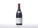 a bottle of red wine sitting on top of a table