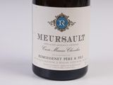 a bottle of wine that is sitting on a table