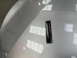 a sticker that is sitting on the hood of a car