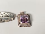 pair of silver and amethorate brooches with leaves