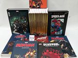 spider - man and deadpool comic books on a white background