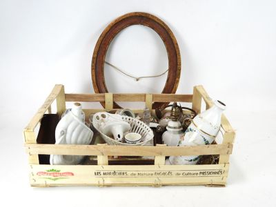 a wooden crate filled with assorted items on a white surface