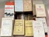 many books that are stacked on top of each other