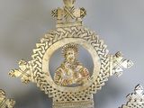 a statue of a woman in the center of a cross